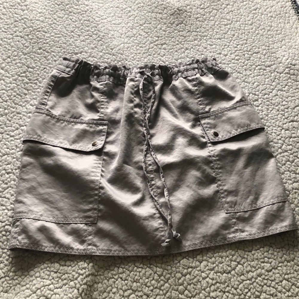 Silver silk material mini skirt with cargo pockets